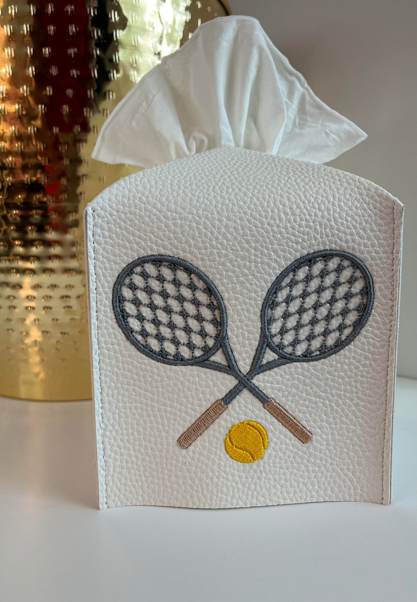 Tennis racquet leather tissue box cover.